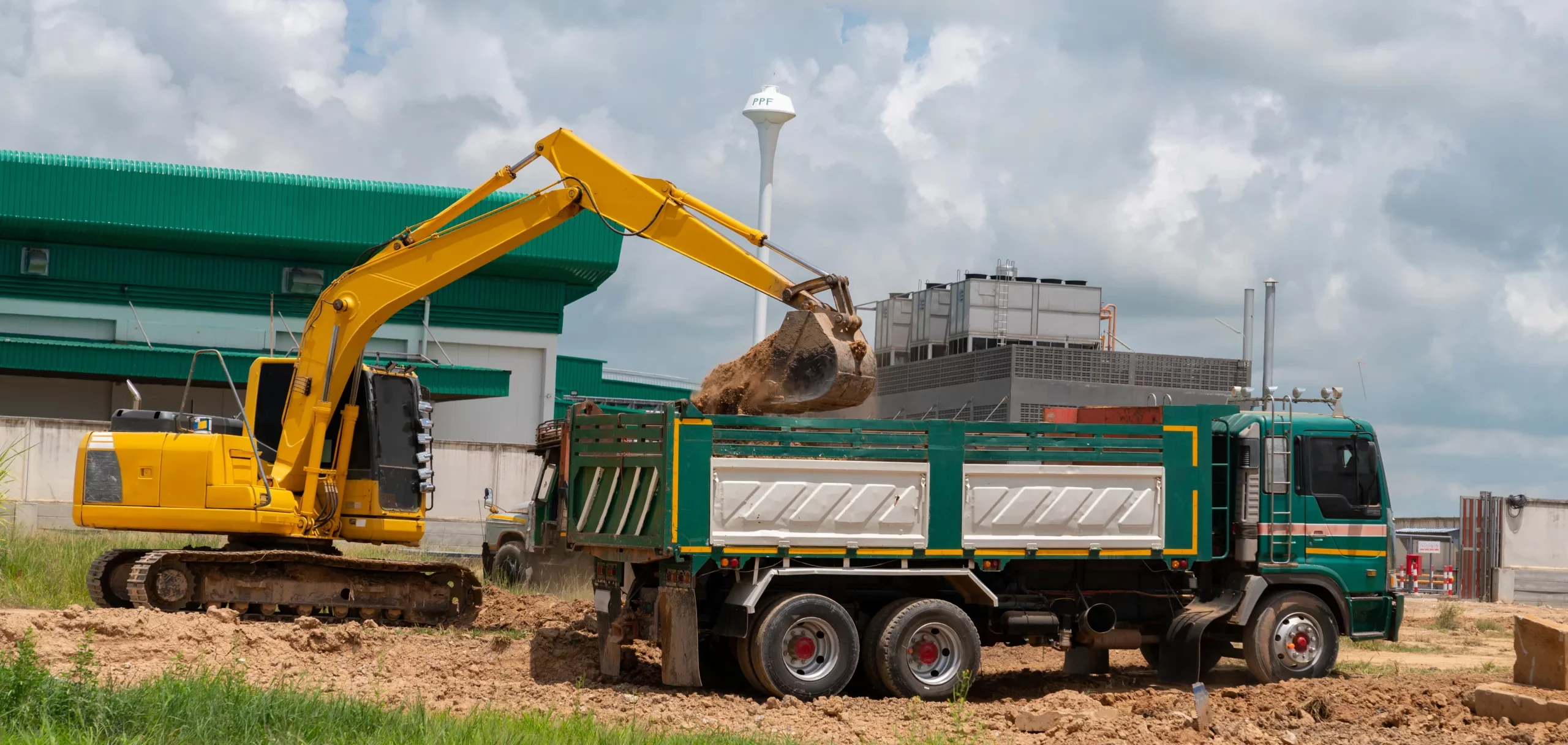 excavator-load-soil-truck-construction-site-1-scaled-e1762859865591