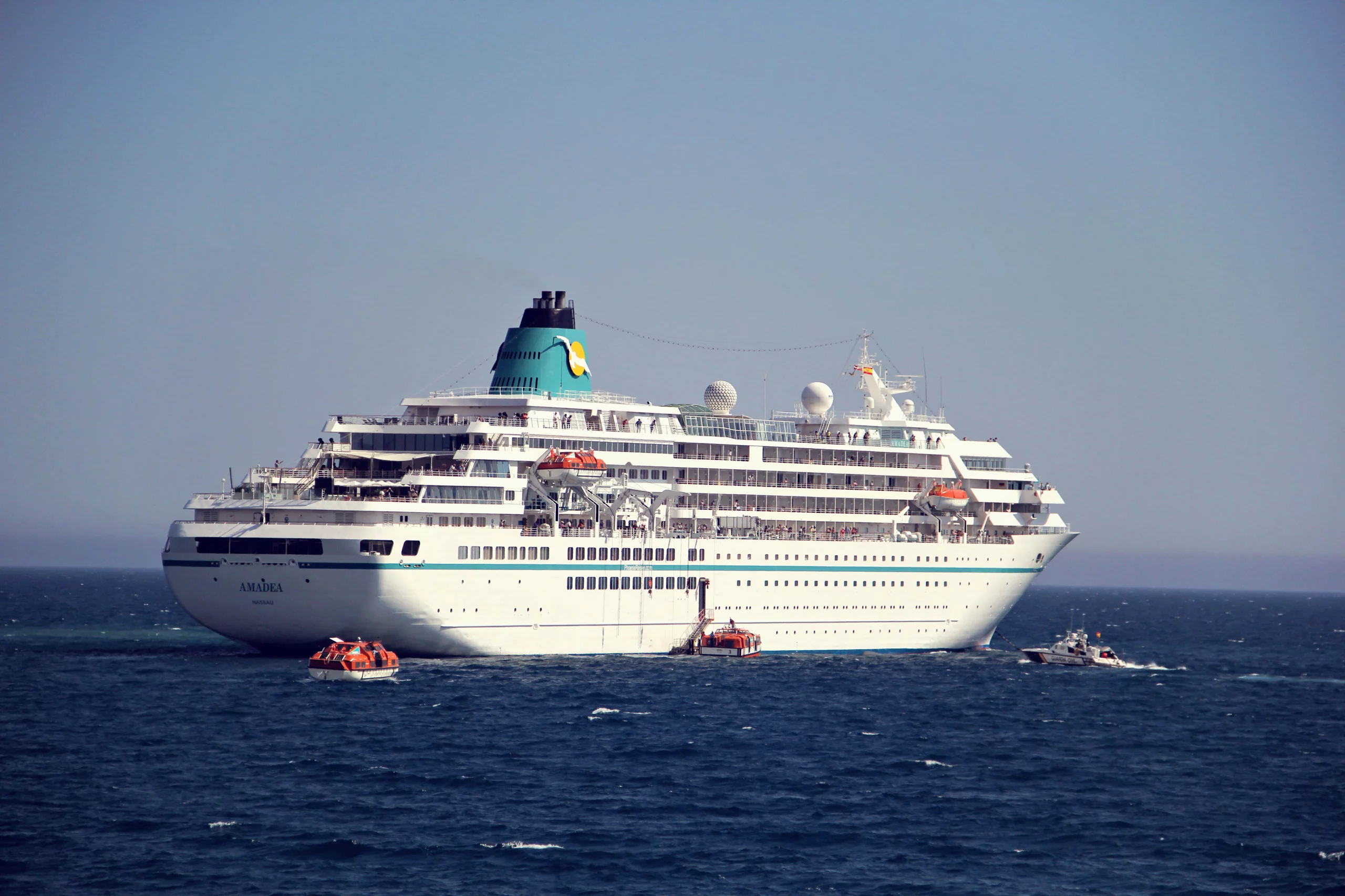 cruise-ship-moving-sea-against-clear-sky-scaled